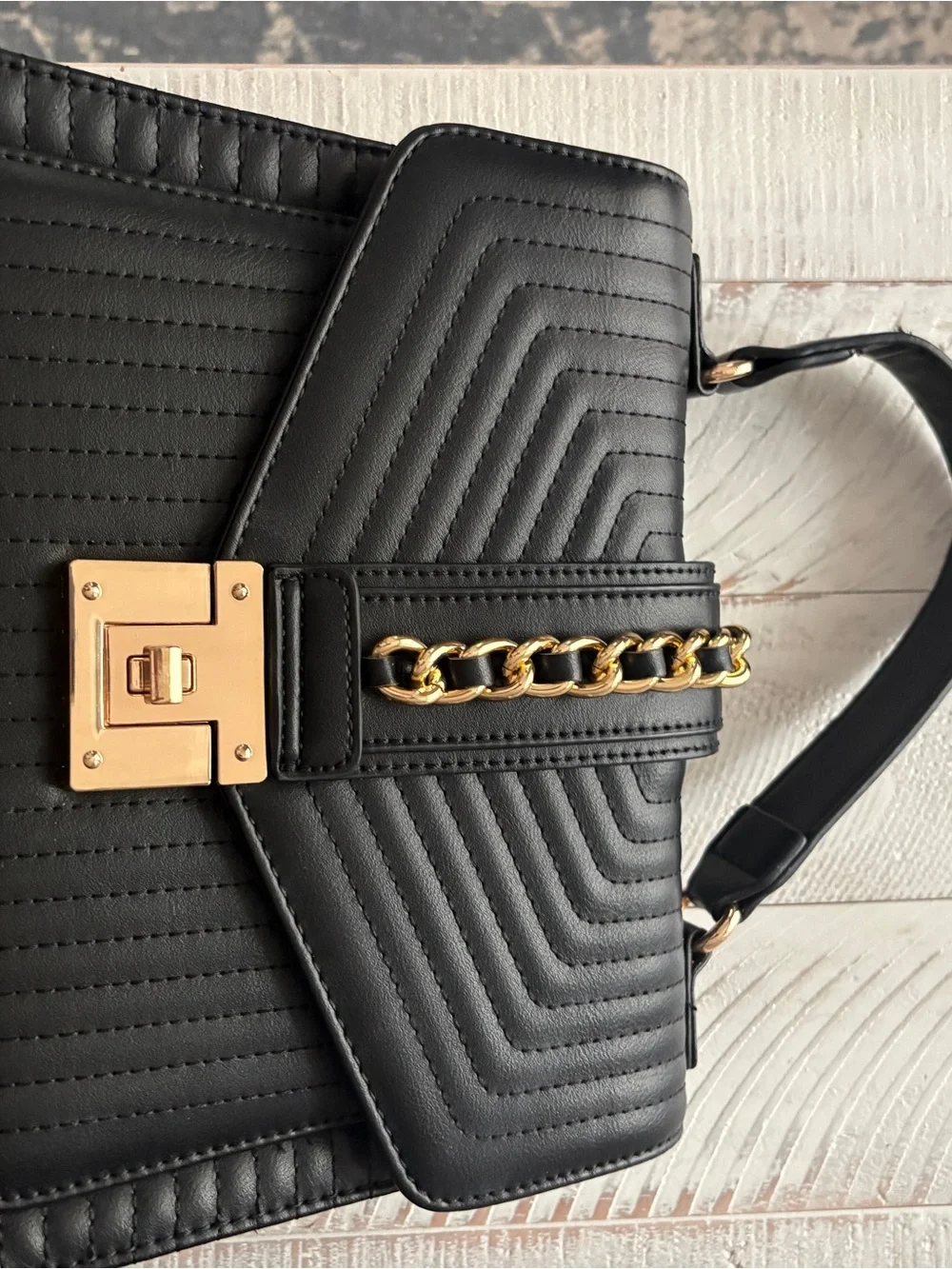 Black Quilted Leather Top-Handle Bag with Gold Chain Accent